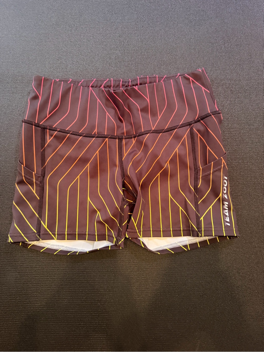 Zoot Women's Pulse Shorts in Black with Pink and Yellow Stripes